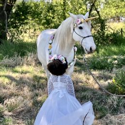 My daughter and Prince posing for a photo My daughter and Prince posing for a photo