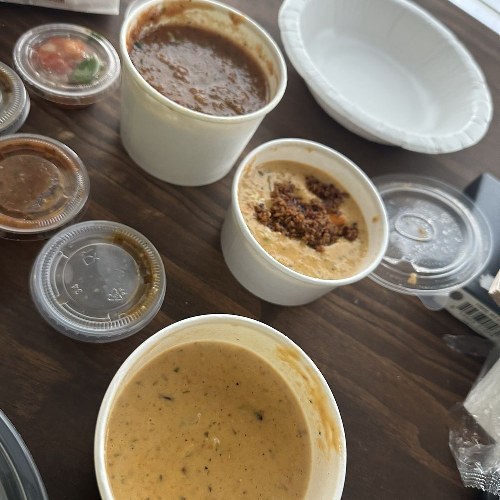 Torchy's Tacos - Queso with chipotle beef, queso without and salsa and chips. They also included small cups of salsa. - Tex-Mex Near Me - Houston, Texas Torchy's Tacos - Queso with chipotle beef, queso without and salsa and chips. They also included small cups of salsa. - Tex-Mex Near Me - Houston, Texas