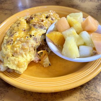 Outpost Cafe - an omelet, fruit, and a bowl of fruit - American Near Me - Oak Hills, California
