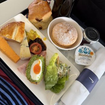 British Airways - Cheeses, lunch meats, coleslaw, Scotch egg, raisin biscuit with clotted cream and jam and a dessert muffin. - Airlines Near Me - West Drayton, XGL British Airways - Cheeses, lunch meats, coleslaw, Scotch egg, raisin biscuit with clotted cream and jam and a dessert muffin. - Airlines Near Me - West Drayton, XGL