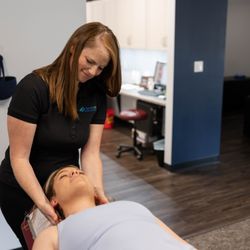Reclaim Chiropractic - Chiropractor adjusting patients neck