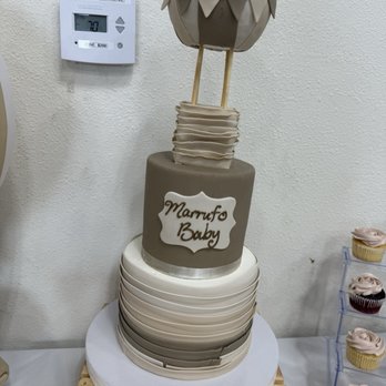 Simply Sweet Cakes - Final brown cake with messy name - note the body is different from the inspo pic - Cupcakes Near Me - Santa Ana, California Simply Sweet Cakes - Final brown cake with messy name - note the body is different from the inspo pic - Cupcakes Near Me - Santa Ana, California