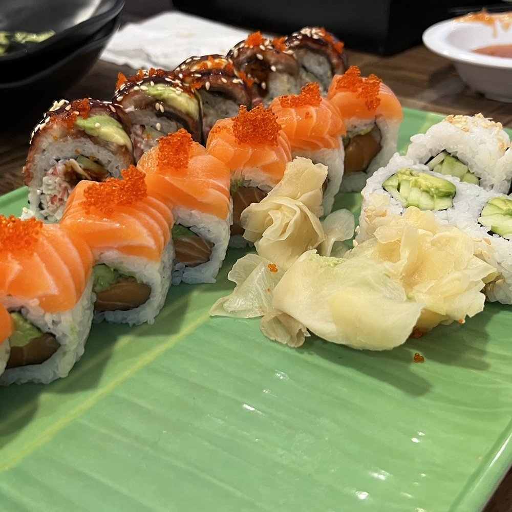 Sakura Sushi - Thick Salmon on that Orange Blossom Roll with the Dragon roll with crispy, warm tempura shrimp in the background. Fantastic! - Sushi Bars Near Me - Roseburg, Oregon