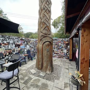 The Red Rooster Bar & Grill - Irish carvings outside seating area - Pubs Near Me - Wrentham, Massachusetts