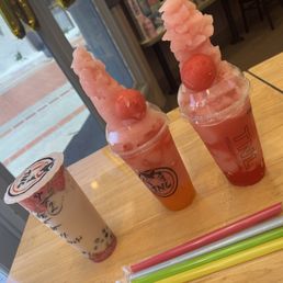 Rose milk tea with oat milk and mango slushies with popping boba. Rose milk tea with oat milk and mango slushies with popping boba.