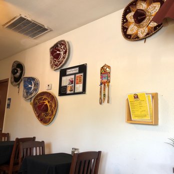La Conquista Taqueria - a dining room with several plates on the wall - Mexican Near Me - Redding, California La Conquista Taqueria - a dining room with several plates on the wall - Mexican Near Me - Redding, California