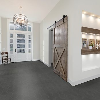 Tile Town - a kitchen and dining room with a barn door - Flooring Near Me - Victoria, British Columbia Tile Town - a kitchen and dining room with a barn door - Flooring Near Me - Victoria, British Columbia