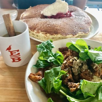 Early Bird - Frank's Chicken and Waffles with greens, double griddle cake, and Mexican Coffee...sooo filling! - New American Near Me - Fullerton, California
