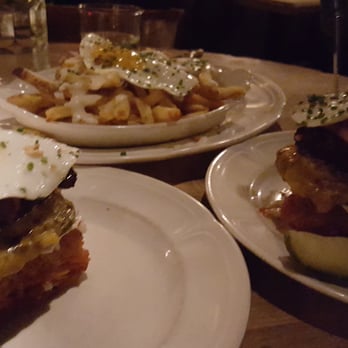Au Cheval - Cheeseburger with hash brown bun, thick cut bacon, and an egg. Also a side of cheese fries - Bars Near Me - Chicago, Illinois