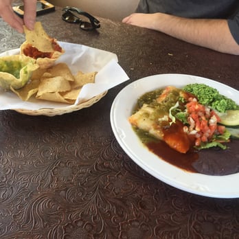 La Plancha - Chips with 2 salsas + Salvadorian tamales, Christmas style, with refried black beans, green rice, and pickled veggies. - Latin American Near Me - Santa Fe, New Mexico La Plancha - Chips with 2 salsas + Salvadorian tamales, Christmas style, with refried black beans, green rice, and pickled veggies. - Latin American Near Me - Santa Fe, New Mexico
