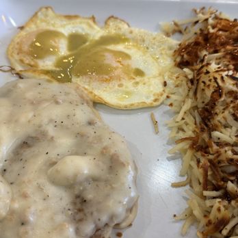 French Toast Cafe - My Chicken Country Fried Steak 2 over easy and hash browns well painted in house variety sauces - Breakfast & Brunch Near Me - Mesa, Arizona