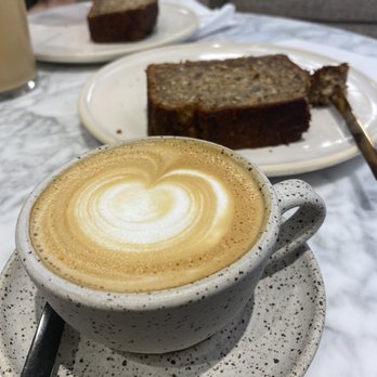 Suited - Flat white, banana-walnut-coconut bread - Breakfast & Brunch Near Me - New York, New York Suited - Flat white, banana-walnut-coconut bread - Breakfast & Brunch Near Me - New York, New York