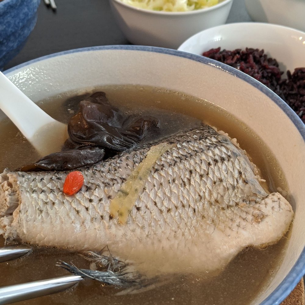 a fish in a bowl of soup a fish in a bowl of soup