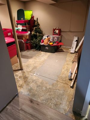 Basement Flood Restoration - This basement in Avon Lake was flooded due to a broken water line. Our crew came in and cleaned up the water, dried out the surfaces, and replaced the damaged flooring.