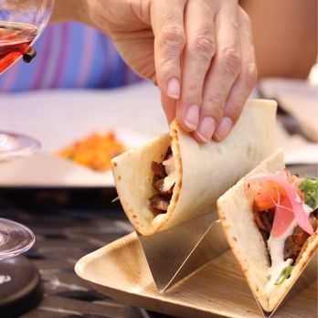 Fazeli Cellars Winery - a person taking a burrito - Wineries Near Me - Temecula, California Fazeli Cellars Winery - a person taking a burrito - Wineries Near Me - Temecula, California