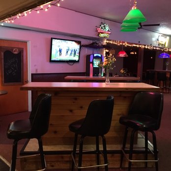 The Coyote Club - a bar with stools and a television - Pubs Near Me - Shelby, Montana The Coyote Club - a bar with stools and a television - Pubs Near Me - Shelby, Montana