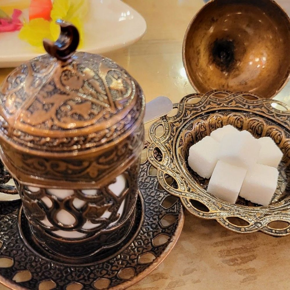 Koy Grill - sugar cubes in a bowl next to a coffee pot - Mediterranean Near Me - Englishtown, New Jersey Koy Grill - sugar cubes in a bowl next to a coffee pot - Mediterranean Near Me - Englishtown, New Jersey