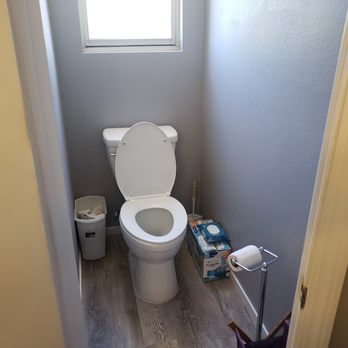 Crue Construction - a toilet in a small bathroom - General Contractors Near Me Crue Construction - a toilet in a small bathroom - General Contractors Near Me