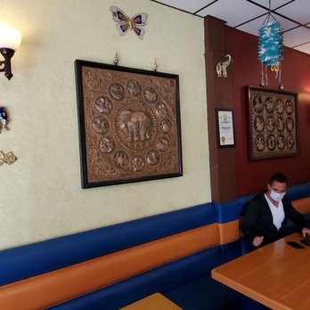 Pailin Thai Cuisine - a man sitting at a table - Thai Near Me - Los Angeles, California Pailin Thai Cuisine - a man sitting at a table - Thai Near Me - Los Angeles, California
