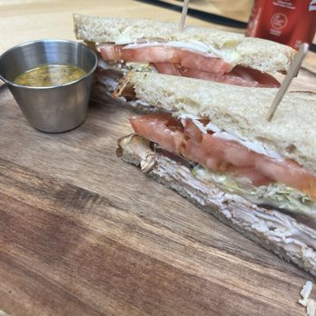 The Butcherman - a cut in half sandwich on a cutting board - Barbeque Near Me - Sonoma, California The Butcherman - a cut in half sandwich on a cutting board - Barbeque Near Me - Sonoma, California