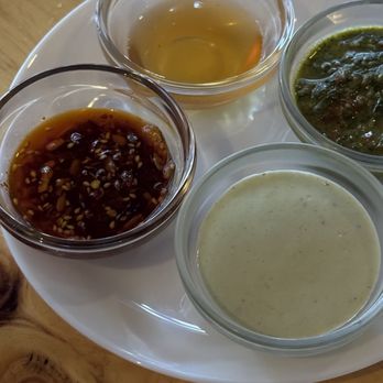 Jules - Sauce Flight (sunflower sesame chili crisp, hot fermented garlic honey, that green sauce, tarragon miso ranch) - Pizza Near Me - San Francisco, California Jules - Sauce Flight (sunflower sesame chili crisp, hot fermented garlic honey, that green sauce, tarragon miso ranch) - Pizza Near Me - San Francisco, California