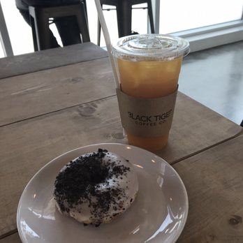 Black Tiger Coffee - Iced peach earl grey tea and cookies & cream donut - Coffee & Tea Near Me - Surrey, British Columbia