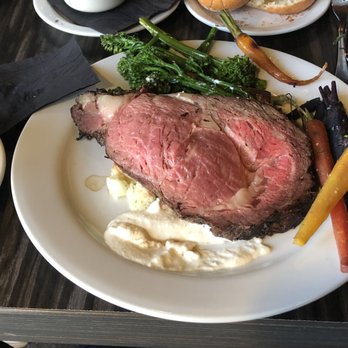 Cliff Dining Pub - Prime rib, rainbow carrots, broccolini, garlic mash, and creamy horseradish. Au Jus out of frame on the left. - Sushi Bars Near Me - Draper, Utah Cliff Dining Pub - Prime rib, rainbow carrots, broccolini, garlic mash, and creamy horseradish. Au Jus out of frame on the left. - Sushi Bars Near Me - Draper, Utah