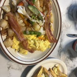 Mikki's Cafe - French toast combo with eggs, home style potatoes and bacon.