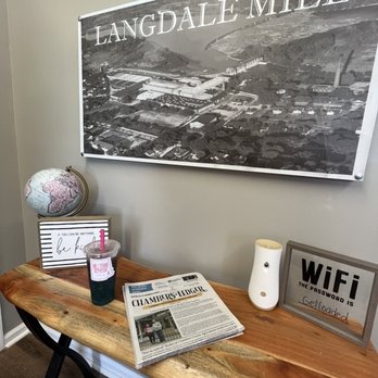 Milltown Nutrition - a table with a newspaper and a globe - Juice Bars & Smoothies Near Me - Valley, Alabama