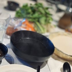 Anh Hong - Every table gets a hot water bath, veggies, rice paper