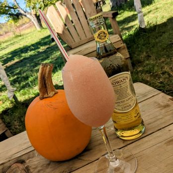 Gowan’s Cider - Glass of frozé with a bottle of spiced apple cider - Cideries Near Me - Philo, California
