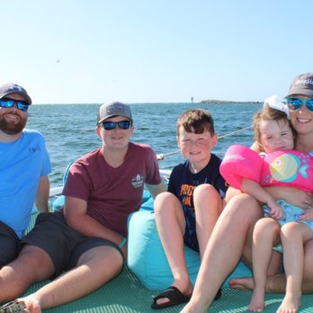 Smile n Wave Sailing Adventures - Hanging out on the front of the catamaran - Boating Near Me - Destin, Florida Smile n Wave Sailing Adventures - Hanging out on the front of the catamaran - Boating Near Me - Destin, Florida