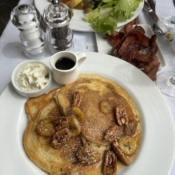 Artisan Restaurant - Banana buttermilk pancakes and artisan petit steak and sub edge farm egg and smoked bacon. - Breakfast & Brunch Near Me - West Hartford, Connecticut Artisan Restaurant - Banana buttermilk pancakes and artisan petit steak and sub edge farm egg and smoked bacon. - Breakfast & Brunch Near Me - West Hartford, Connecticut