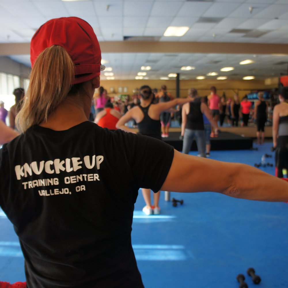 Knuckle Up Training Center - Couch Cheryl showing off her stuff. - Martial Arts Near Me - Vallejo, California Knuckle Up Training Center - Couch Cheryl showing off her stuff. - Martial Arts Near Me - Vallejo, California