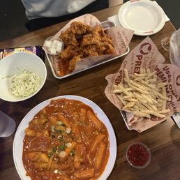 half crispy fried boneless with signature sauce, peli shaken fries, rose tteokbokki half crispy fried boneless with signature sauce, peli shaken fries, rose tteokbokki