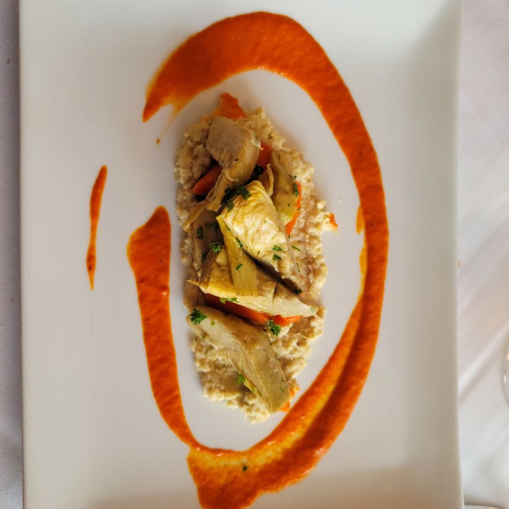 Bistro Barbes - a plate of food on a table - French Near Me - Denver, Colorado