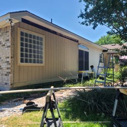 Bloodhound Wildlife Management - Replacing the siding for a customer!
