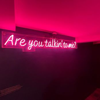 ROC Cinema - a neon sign that says are you talking to me? - Comfort Food Near Me - Rochester, New York