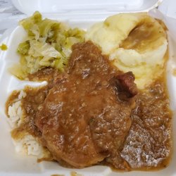 SYI Express Cafe - Smothered pork chop over rice, side of mashed potatoes and cabbage.
