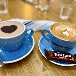 Hot chocolate and a flat white with Tim Tams!!!