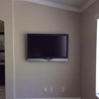 Next Level Lighting & Electric - outlet installed behind tv with other wall plate cover that has hole to put any other cords that we may need in the future - Electricians Near Me Next Level Lighting & Electric - outlet installed behind tv with other wall plate cover that has hole to put any other cords that we may need in the future - Electricians Near Me