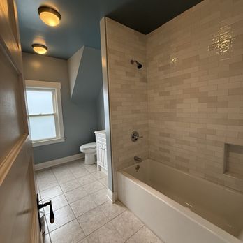 Rosu Construction - Hall Bath After (we left the existing floor intact but they replaced the tub and surround) - General Contractors Near Me Rosu Construction - Hall Bath After (we left the existing floor intact but they replaced the tub and surround) - General Contractors Near Me