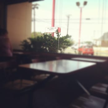 Chicken Express - a table and chairs in a restaurant - Fast Food Near Me - Henderson, Texas