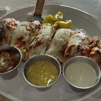 Tipsy Tomato - Calzone w/ sauces - Burgers Near Me - Oklahoma City, Oklahoma Tipsy Tomato - Calzone w/ sauces - Burgers Near Me - Oklahoma City, Oklahoma