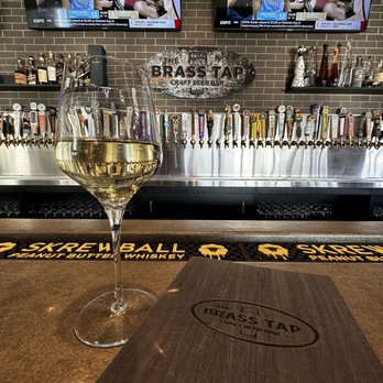 The Brass Tap - glass of wine on a bar - Beer Bar Near Me - Gilbert, Arizona The Brass Tap - glass of wine on a bar - Beer Bar Near Me - Gilbert, Arizona