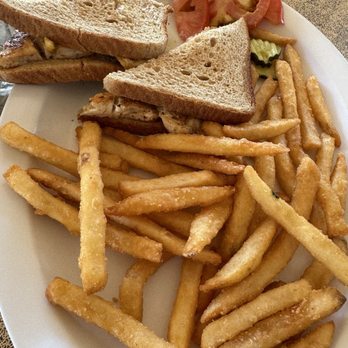 Gilbert's Tiki Bar - Blackened fish sandwich with fries - Tiki Bars Near Me - Key Largo, Florida Gilbert's Tiki Bar - Blackened fish sandwich with fries - Tiki Bars Near Me - Key Largo, Florida