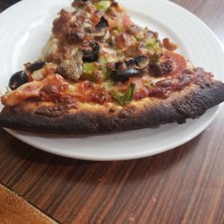 Pelicans Pizza & Ice Cream - 30 dollars for 1 pizza and its burnt. Really?