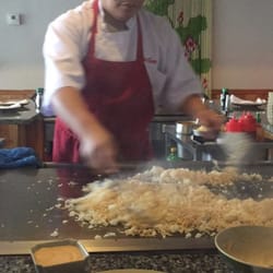 Friendly chef frying up some rice
