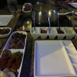 The Melting Pot - The Classic* Entrée Fondue with Sauces.
