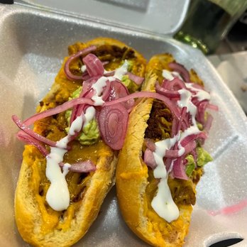 Luchita’s - Molletes (2) served with guacamole , sour cream and red onions - Tacos Near Me - San Antonio, Texas Luchita’s - Molletes (2) served with guacamole , sour cream and red onions - Tacos Near Me - San Antonio, Texas